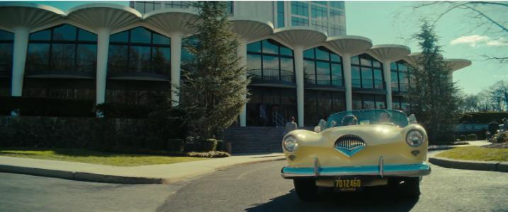A car pulls up to the Vault-Tec headquarters in the “Fallout” TV show, where they planned the mass destruction of the world for corporate profits, a theme throughout the entire “Fallout” series (Photo By: Amazon Prime).
